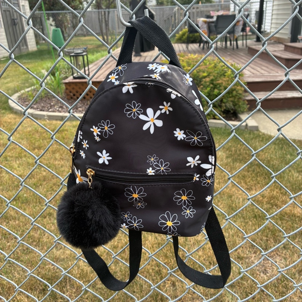 Like Dreams Nylon Mini Black Daisy Floral Backpack With Fur Ball Charm